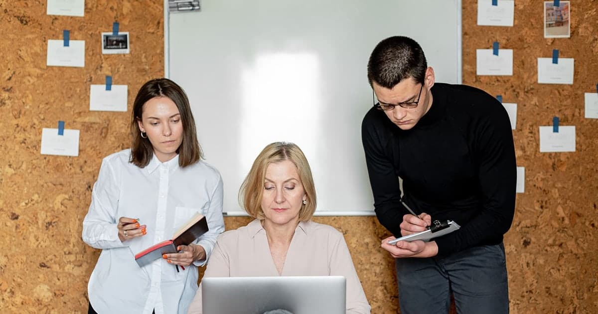 Business team discussing a plan around an office table
