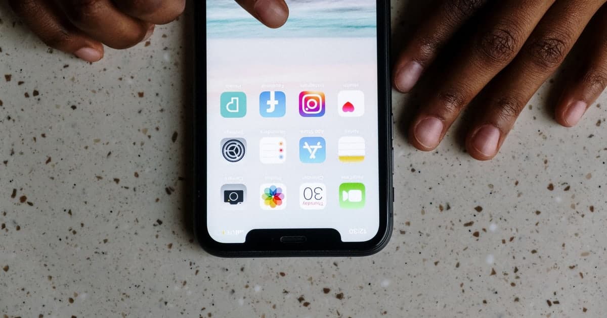 A smartphone with social app icons on a tabletop